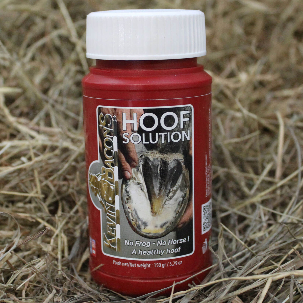 Kevin Bacons Hufpflege Hoofsolution Hufstrahl, roter Behälter 150 ml auf Stroh.
