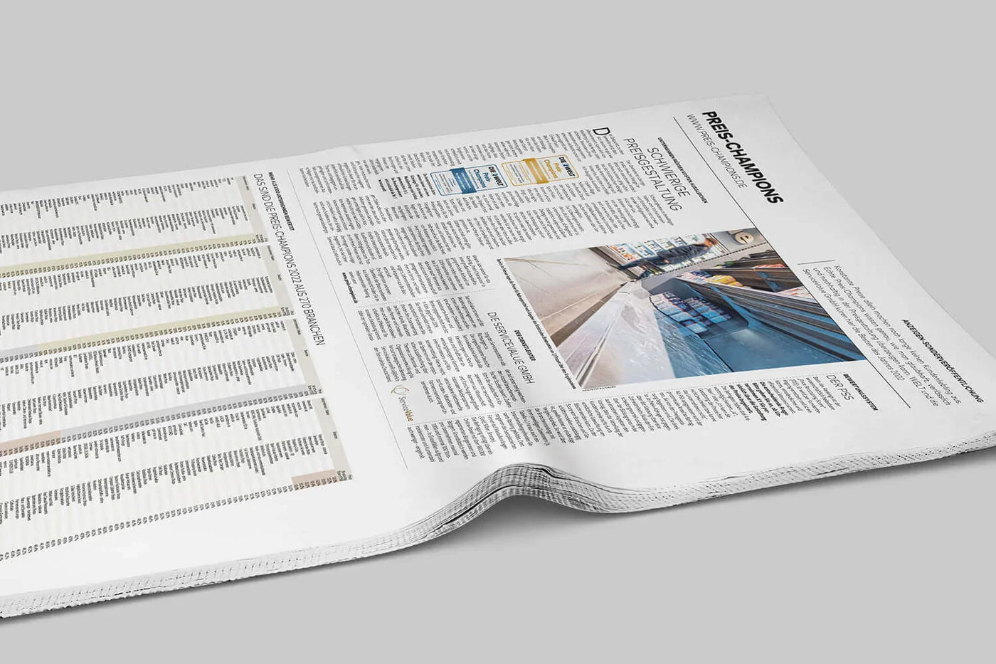Zeitungsseite mit Ranglisten und Überschrift Preis-Champions, Artikel zum Preisbegeisterungs-Ranking.