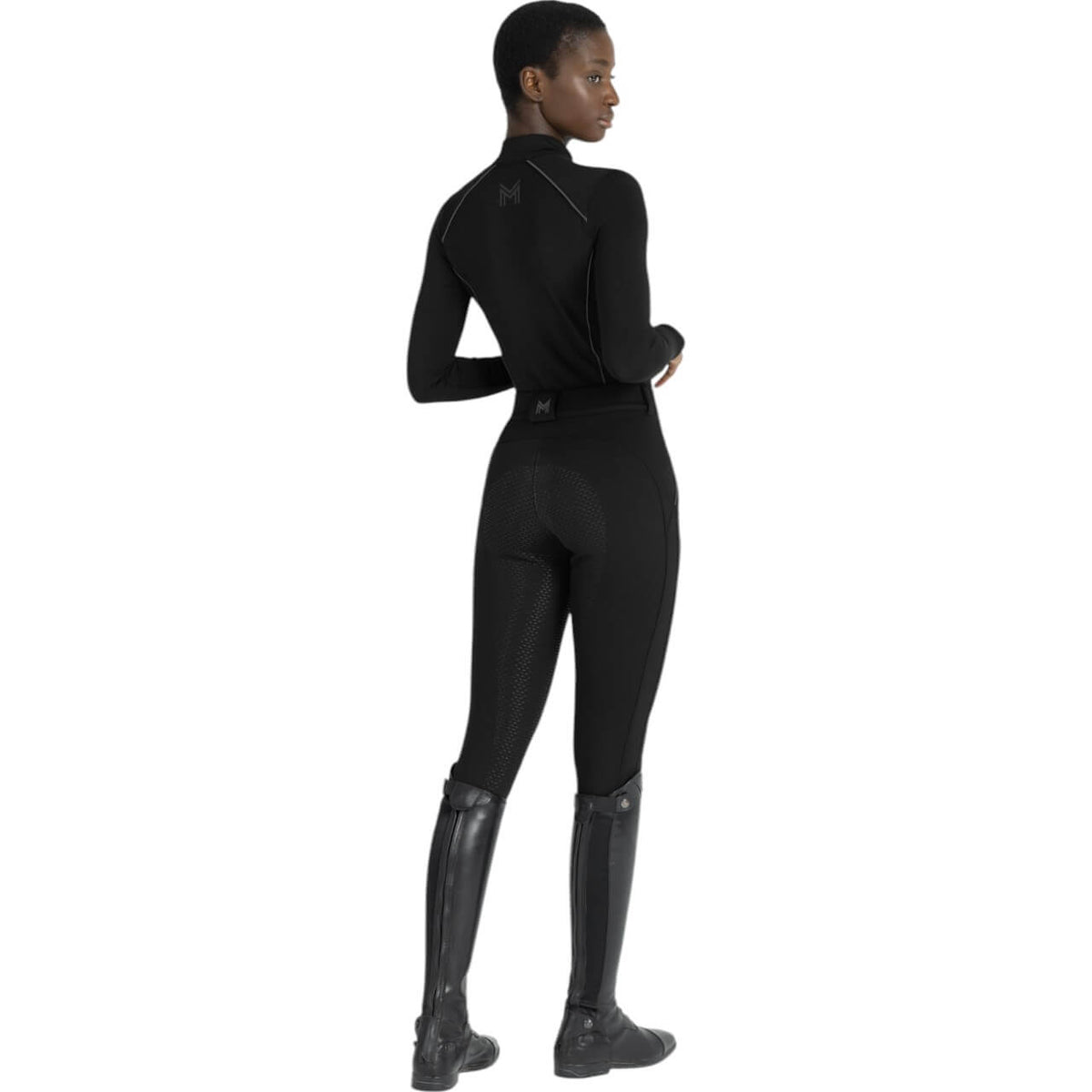 Reithose Damen Full-Grip Arctic Fleeced Breeches, Schwarz, Modell von hinten getragen.
