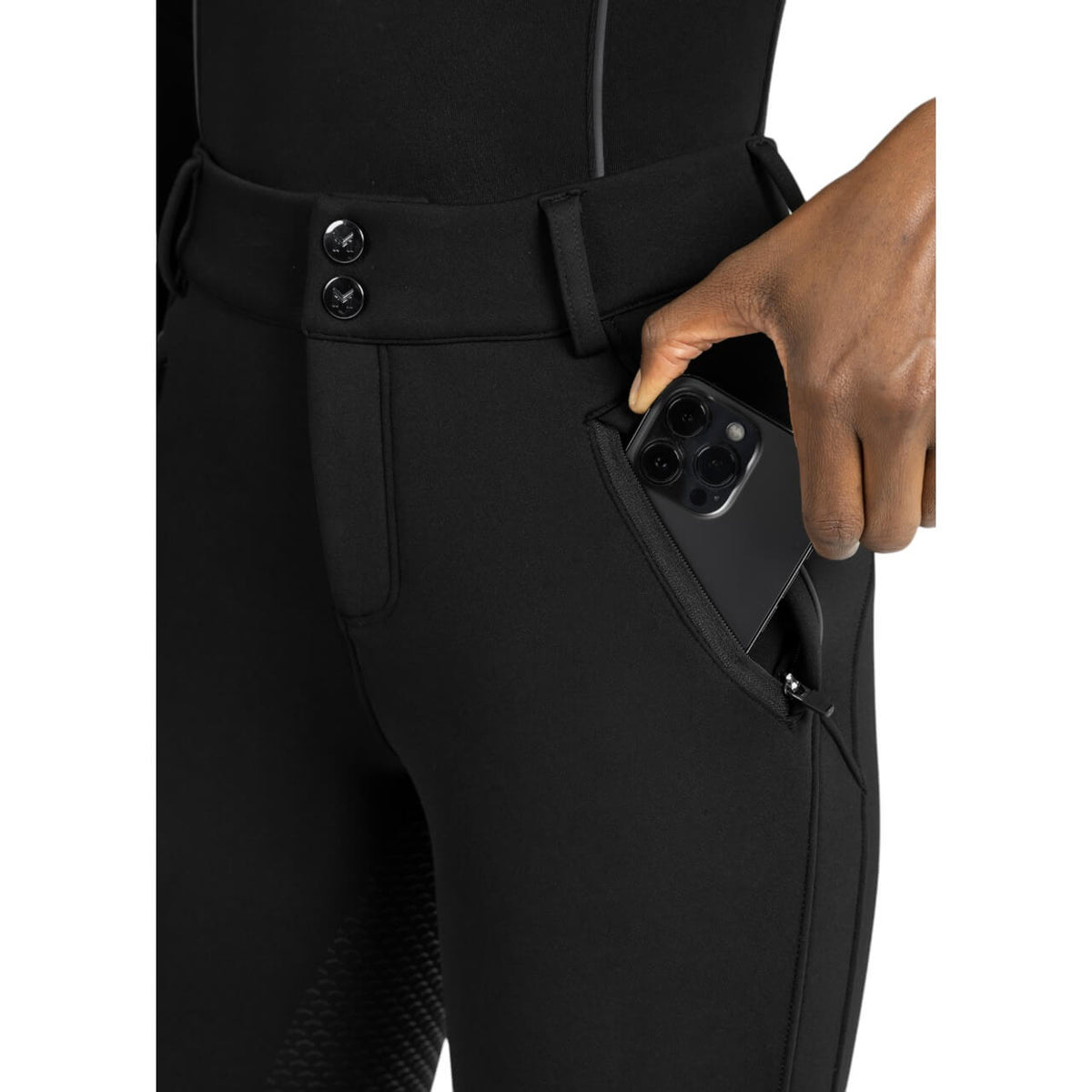 Reithose Damen Full-Grip Arctic Fleeced Breeches, Schwarz, Detailaufnahme mit Handy in der Tasche.